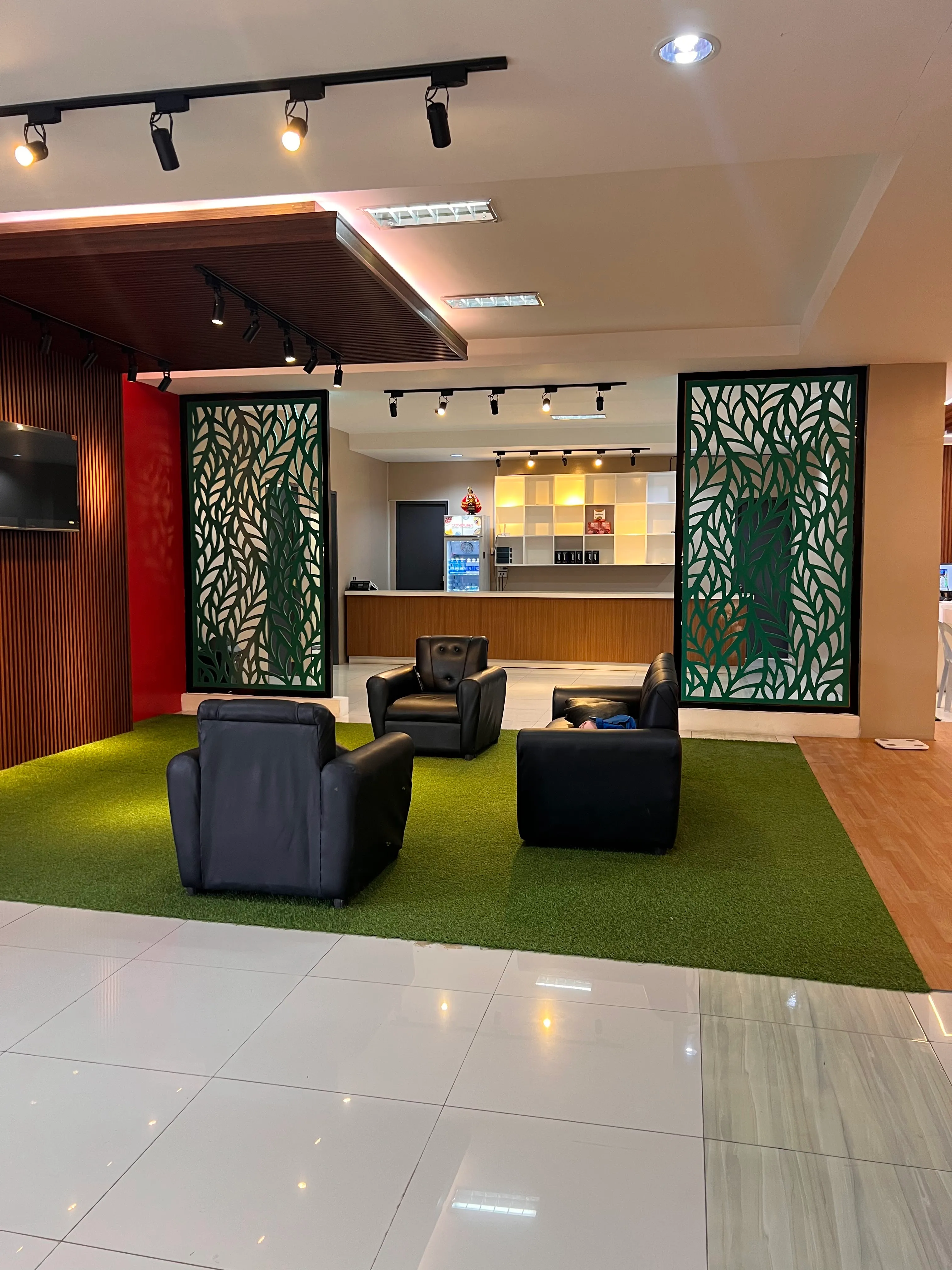 Member lounge with leather chairs on turf
