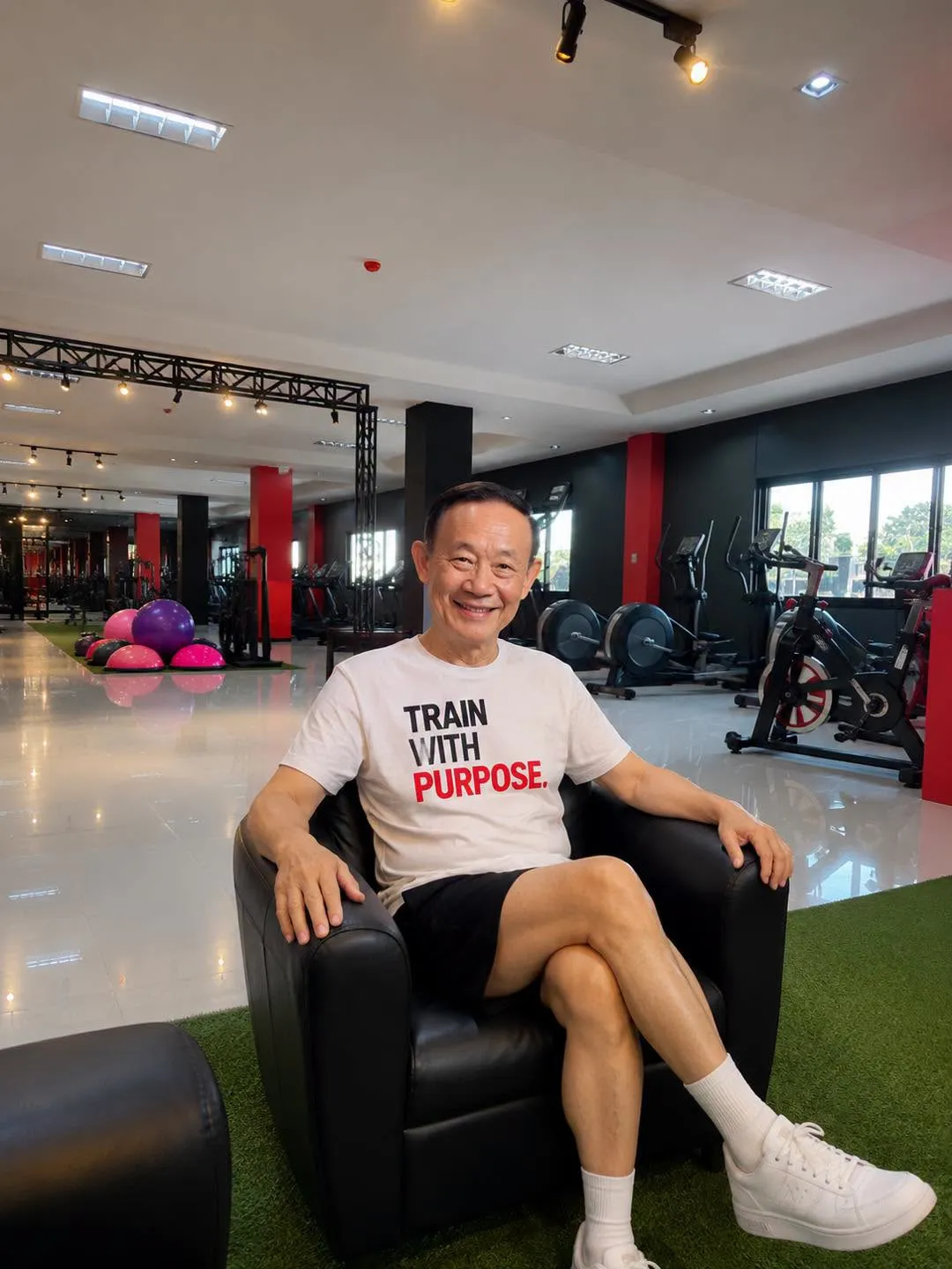 Senior member smiling in a Train With Purpose shirt at H&R